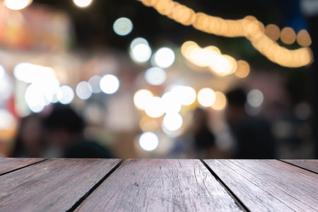 Empty wooden table of brown in front blurred background, can be use to advertising template and...