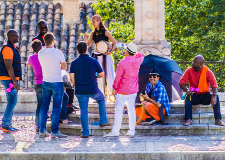 Toledo, Spain - October, 01, 2014: Actors and actresses characterized of medieval characters act for the tourists in the historic city of Toledoのeditorial素材