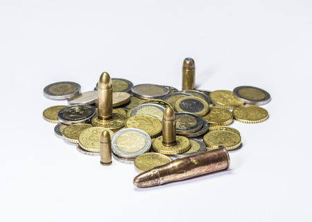Ammunition and money on white backgroundの写真素材