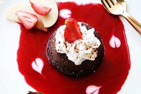 lava cake and strawberry sauceの写真素材