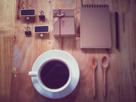 Coffee set as a concept of nostalgic person on wooden table in retro filter effectの素材