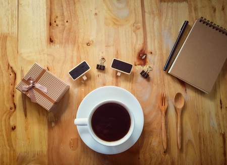 Coffee set as a concept of nostalgic person on wooden table in retro filter effectの素材