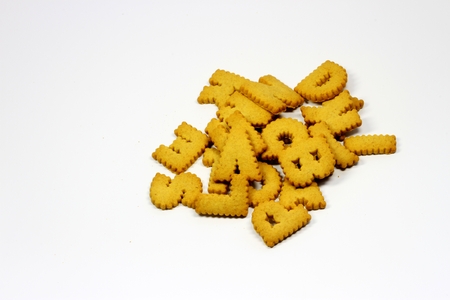 photo of the crackers with letters on white backgroundの写真素材