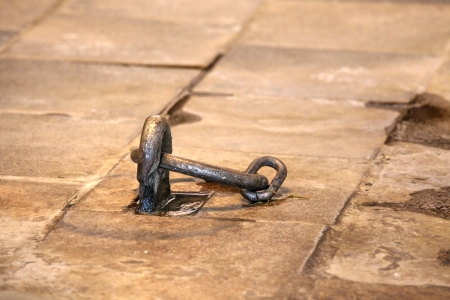 Photo of the fixed Chain into the stone Floor.の写真素材