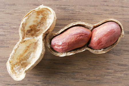 dried peanuts on wooden desk, photo