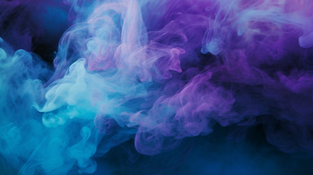 Cloud of blue, pink and purple smoke on a black isolated background. Background from the smoke of vapeの素材