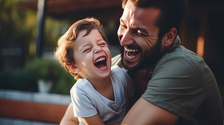 Happy father and son having fun together. They are laughing and laughing.の素材