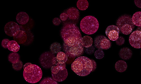 Christmas winter festive background with magic blurred lights red colors on dark
