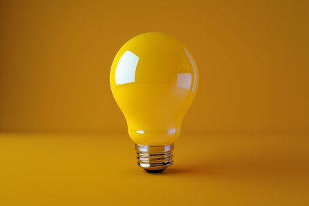 Illuminated Yellow Light Bulb on a Solid Yellow Background with Shadow.の素材