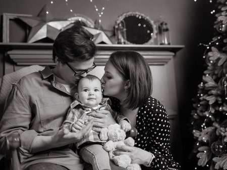 Black and white photo of young family mom dad son