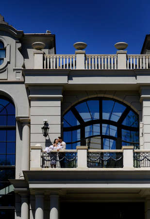 Beautiful young caucasian newlywed couple kissing and huggingの写真素材