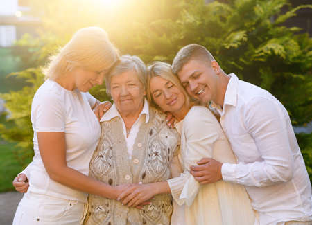 Old grandmother with daughter and granddaughter and grandsonの写真素材