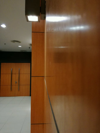 A wooden wall of corridor inside a building