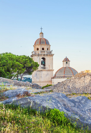 The bell tower of the church of San Lorenzo in Porto Venereの写真素材