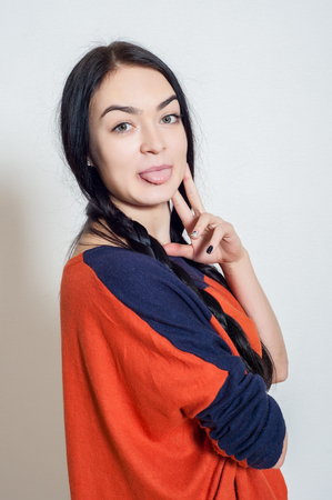 portrait of a beautiful young girl on a light backgroundの写真素材