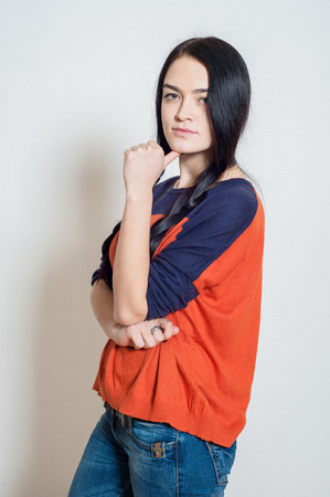 portrait of a beautiful young girl on a light backgroundの写真素材