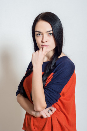 portrait of a beautiful young girl on a light backgroundの写真素材