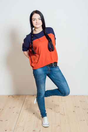 portrait of a beautiful young girl on a light backgroundの写真素材