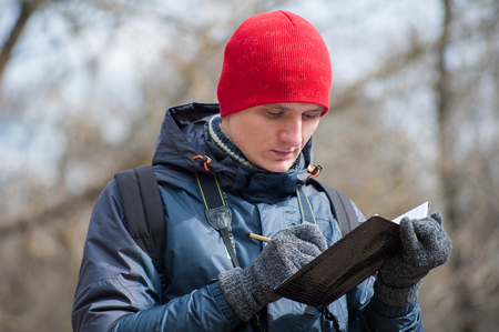a man traveling in a pine forestの写真素材