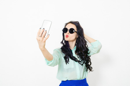 young beautiful girl doing selfieの写真素材