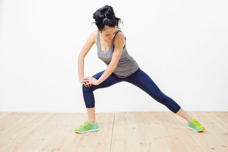 young beautiful girl engaged in fitness at home