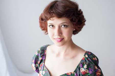 Portrait of a young beautiful smiling girlの写真素材