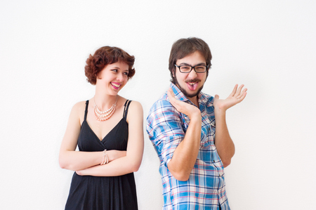 Portrait of smiling brother and sister on a white backgroundの写真素材