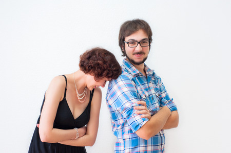 Portrait of smiling brother and sister on a white backgroundの写真素材