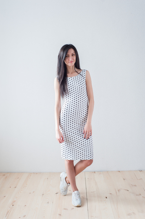 Portrait of a young beautiful girl in a dressの写真素材