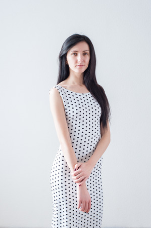 Portrait of a young beautiful girl in a dressの写真素材