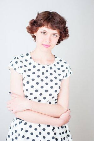 beauty woman portrait of teen girl beautiful cheerful enjoying with short brown hair and clean skin isolated on white backgroundの写真素材