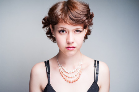 beauty woman portrait of teen girl beautiful cheerful enjoying with short brown hair and clean skin isolated on white backgroundの写真素材