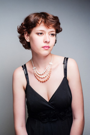 beauty woman portrait of teen girl beautiful cheerful enjoying with short brown hair and clean skin isolated on white backgroundの写真素材