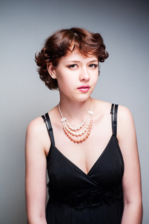 beauty woman portrait of teen girl beautiful cheerful enjoying with short brown hair and clean skin isolated on white backgroundの写真素材