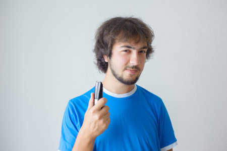 Men's hairstyling and haircutting in a barber shop or hair salon.