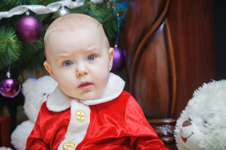 little beautiful baby in costume Santa Clausの写真素材
