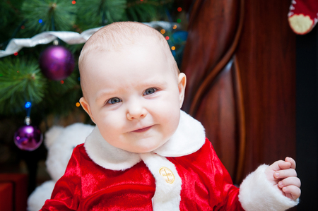 little beautiful baby in costume Santa Clausの写真素材