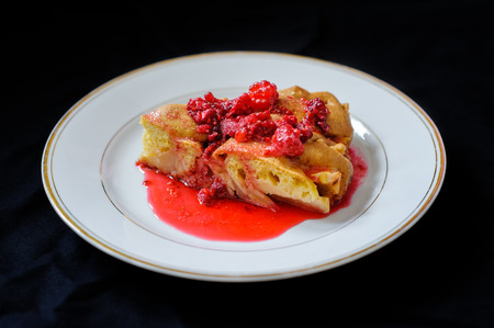 fruit pie with raspberry jam on a dark backgroundの写真素材