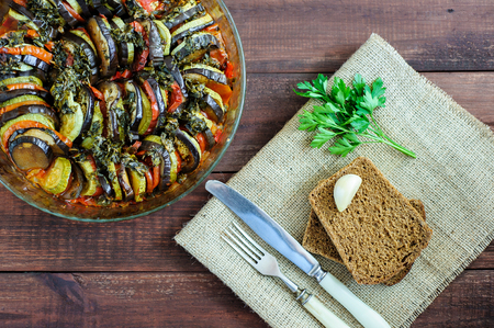 Vegetable ratatouille homemade preparation recipe healthy diet french vegetarian food on vintage wooden table background. Top view. Rustic style.の写真素材