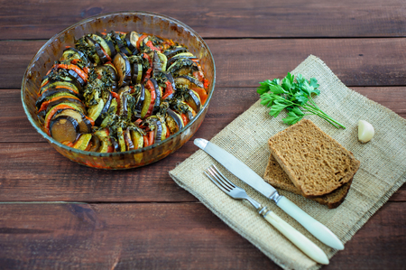 Vegetable ratatouille homemade preparation recipe healthy diet french vegetarian food on vintage wooden table background. Top view. Rustic style.の写真素材