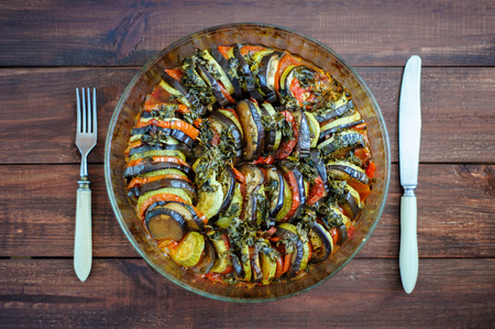 Vegetable ratatouille homemade preparation recipe healthy diet french vegetarian food on vintage wooden table background. Top view. Rustic style.の写真素材