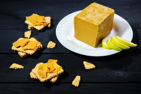 traditional scandinavian organic brown cheese brunost. Healthy Breakfast or snack. Healthy food and eating.の写真素材