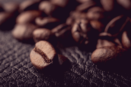 Coffee beans on the leather surface, makro pgotography, cafe conceptの写真素材
