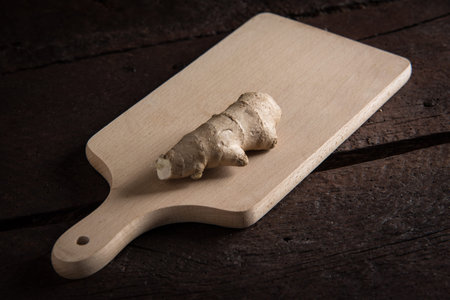 One piece of ginger root on the cutting board
