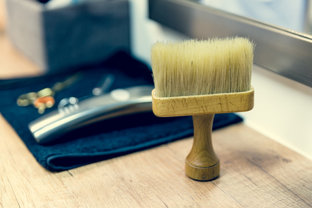 Some barber's tools with brush on the desktopの写真素材