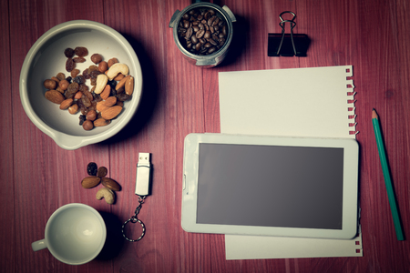 Delicacies in mortar, flat lay view. Nuts, hacelnuts, raisins, almonds. Copyspace.の写真素材