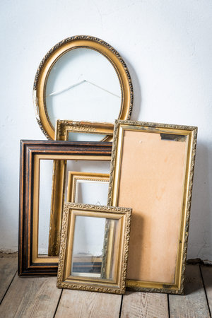 Old wooden painting frames in painter studio