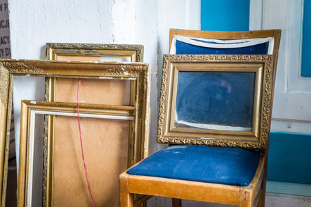 Old wooden painting frames in painter studio