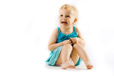Smiling little cure girl in a studio isolated on whiteの写真素材