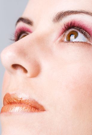 Detail of a face with makeup showing eyes and lipsの写真素材